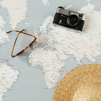 Three more things you should know about me: My bucket list does not fit on one page - image of a map with a camera, sunglasses and hat