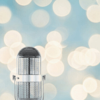 Three more things about me: I love live music. Image of a microphone