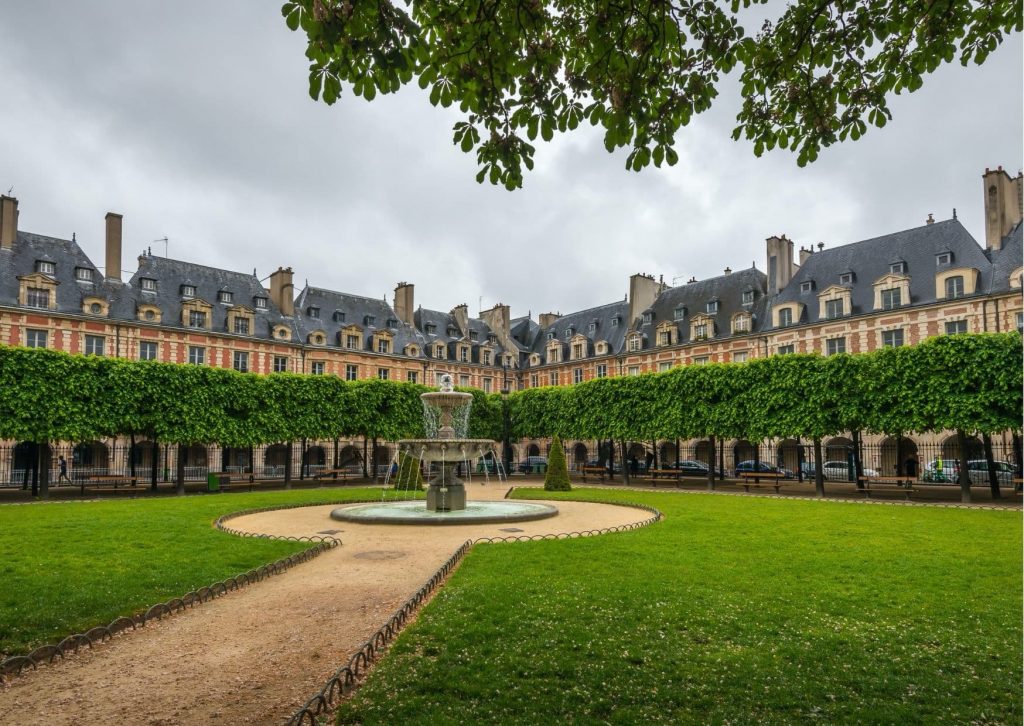 The inspiration for the park next to Marinette's house: Place des Vosges, a must-see on Ladybug's Paris tour