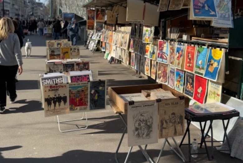 The Bouquinistes of Paris, or booksellers of Paris, along the Seine. We bought a few souvenirs from them while strolling along the Seine during our trip to Paris with a chemo patient (me).