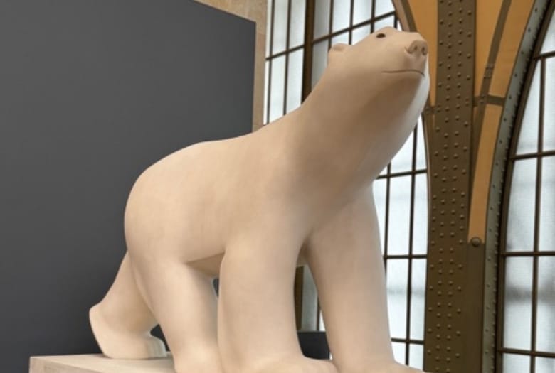 Pompom, a statue or a white polar bear by François Pompom, which serves as inspiration for the kids audio guide at Musée d'Orsay.