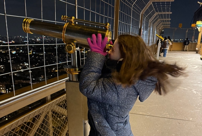 Miss M checking out the view of Paris from the Eiffel tower. Her chemo patient mama declined the opportunity to ascend the tower again.
